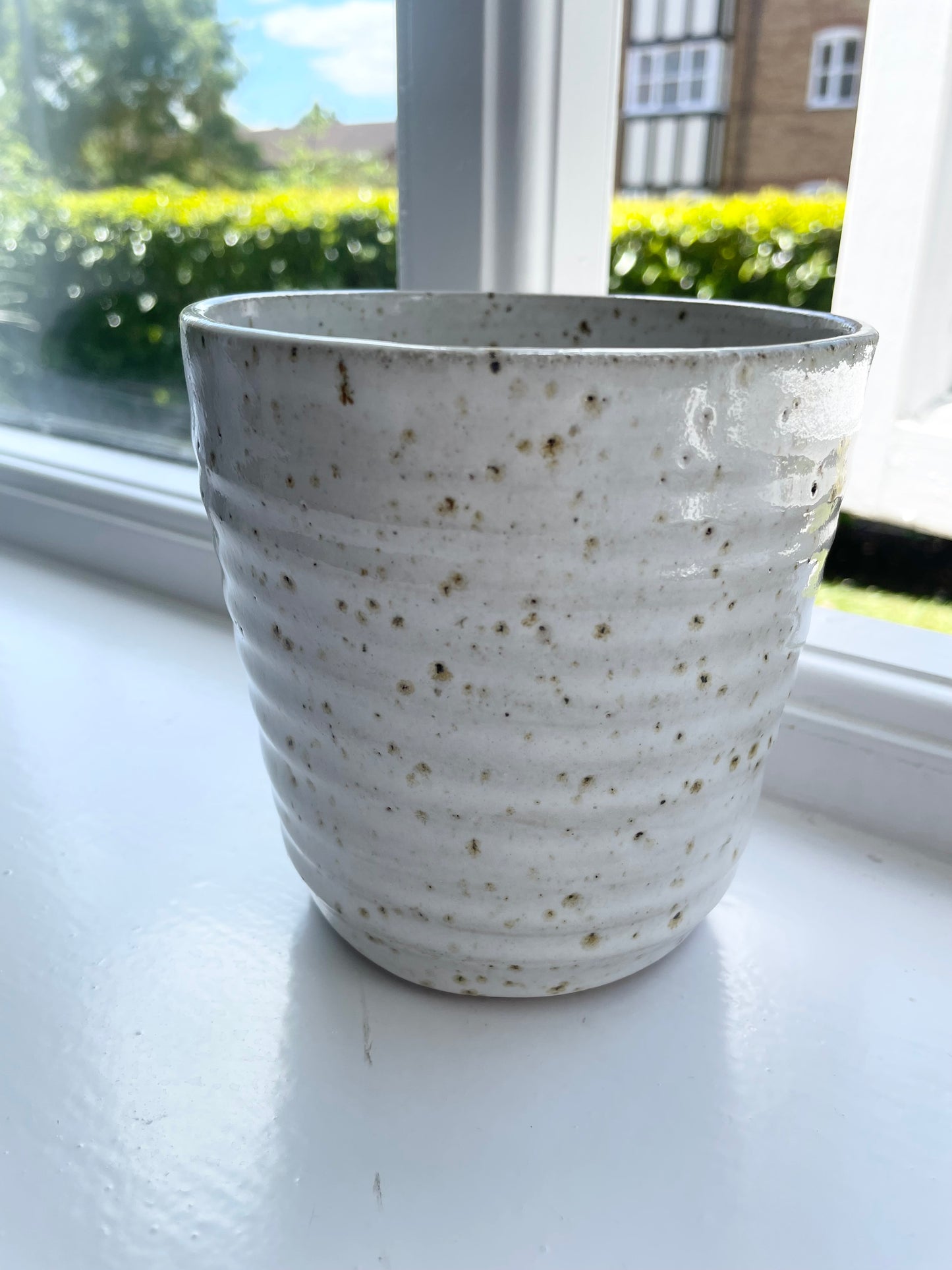 Pot in flecked white with spiral pattern, handmade ceramics