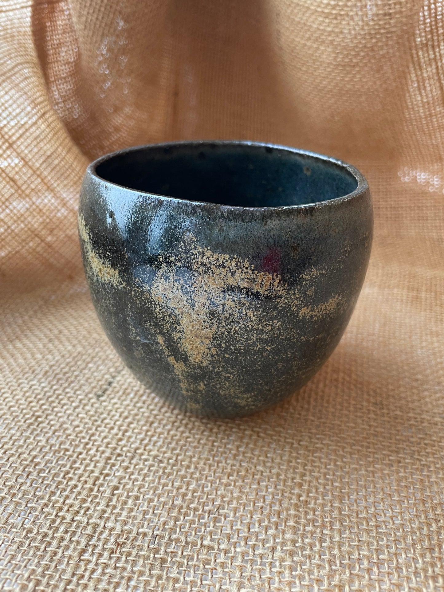 Mug in black with gold specks, pebble shape, handmade ceramics #1