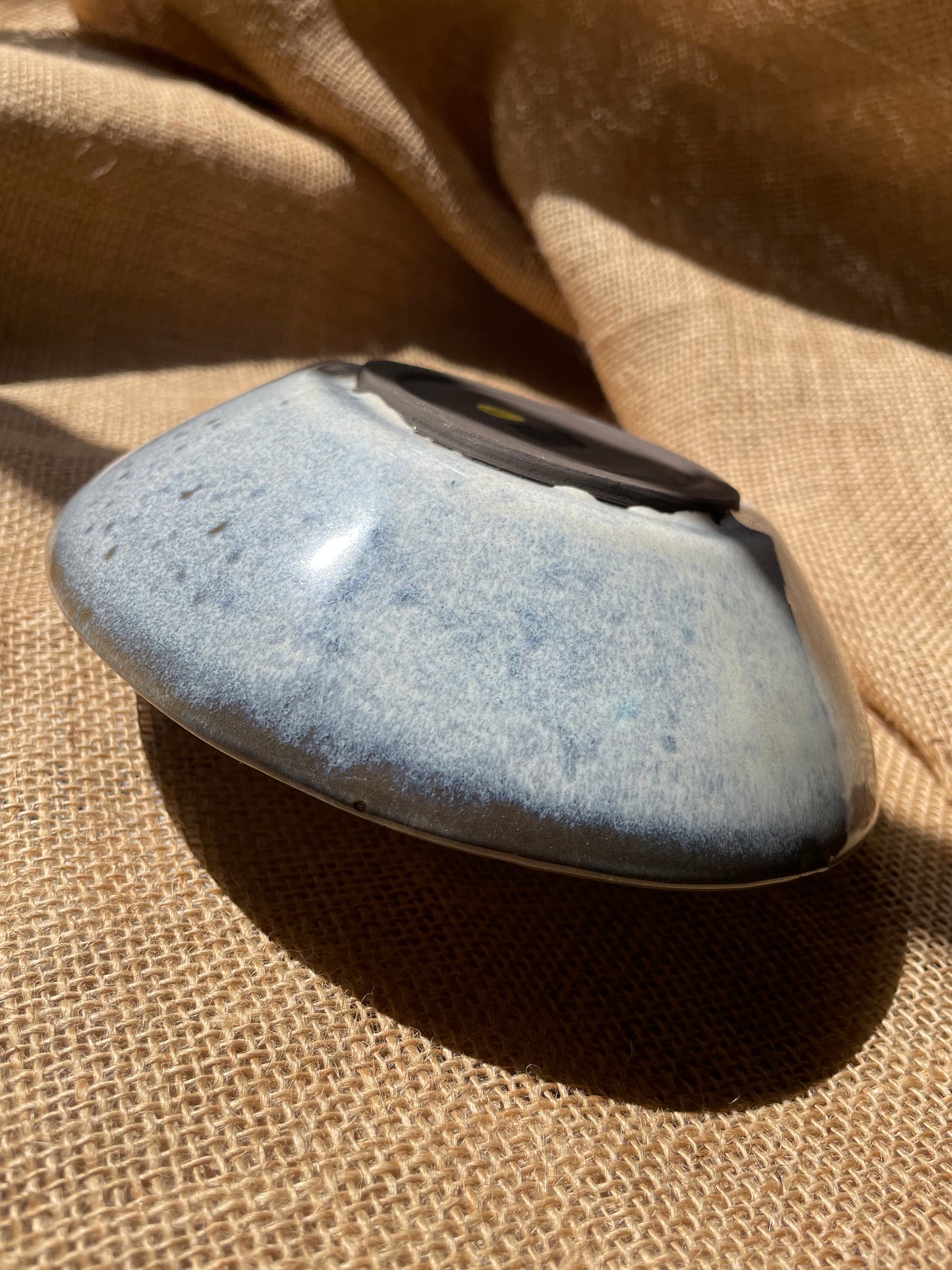 Glossy bowl in light blue, smooth, handmade ceramics