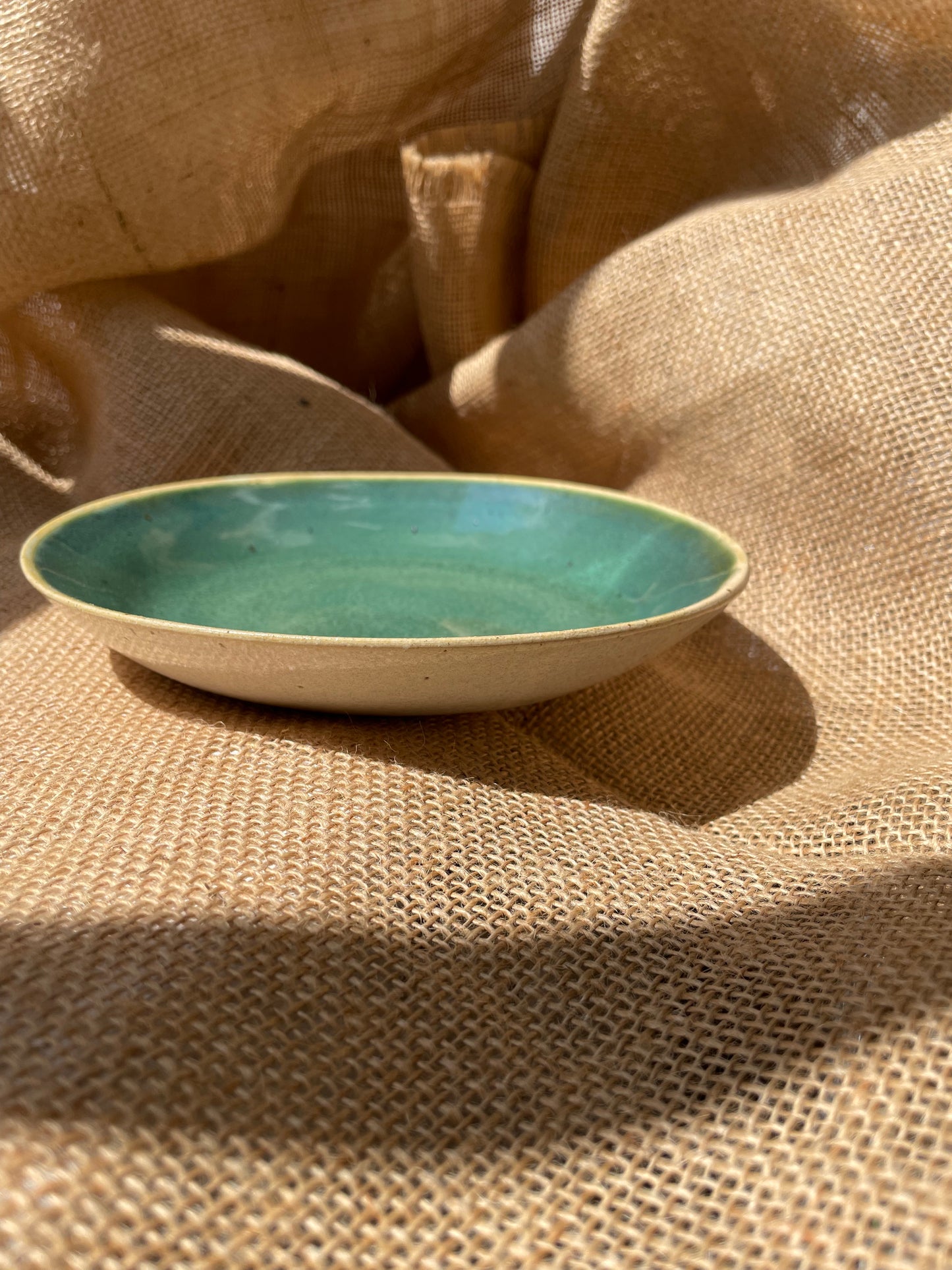 Plate in green, smooth, handmade ceramics