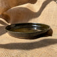 Plate in dark brown, vintage style, rough and glossy surface