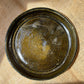 Plate in dark brown, vintage style, rough and glossy surface