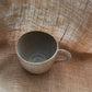 Question Mug in light brown, slightly grogged, handmade ceramics